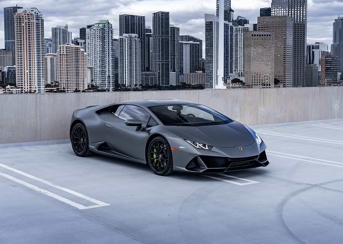 Gray Lamborghini Huracan with Cityscape