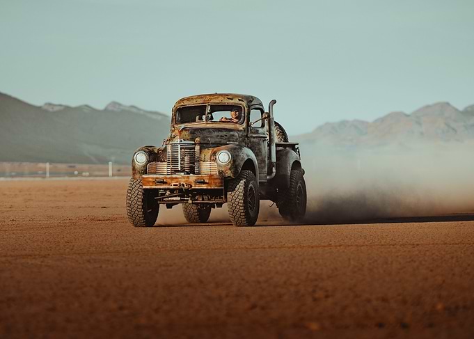 Vintage Truck Off-Roading in Desert Landscape