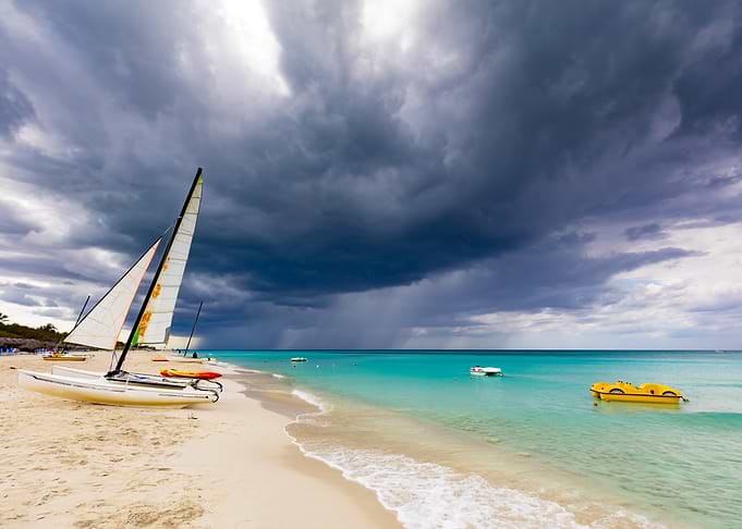 Beach scene with storm clouds, Cuba