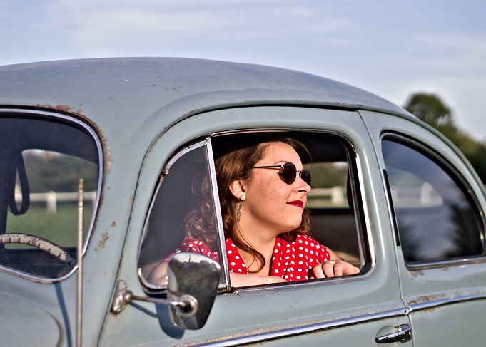 Woman in Vintage Car with Sunglasses