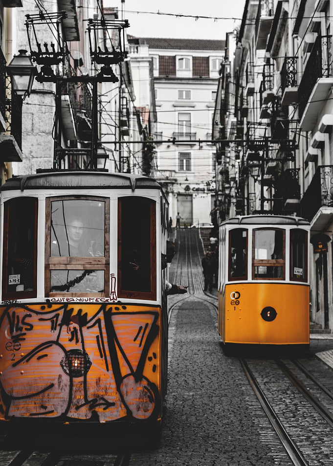 Lisbon Trams on a Cobblestone Street