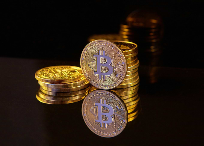 Bitcoin Cryptocurrency Stack on Reflective Surface