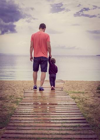 Father and Daughter Beach Walk
