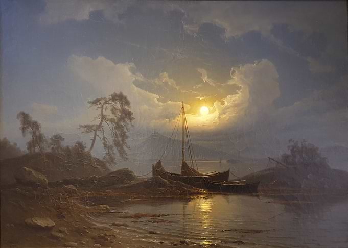 Sunset over the lake with boats