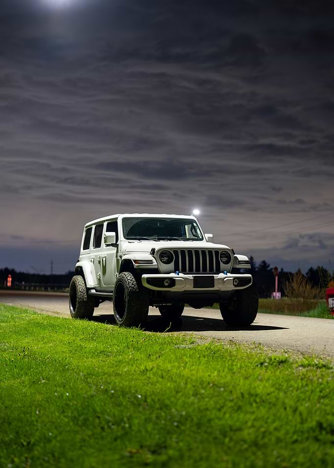 White Jeep Wrangler at Night