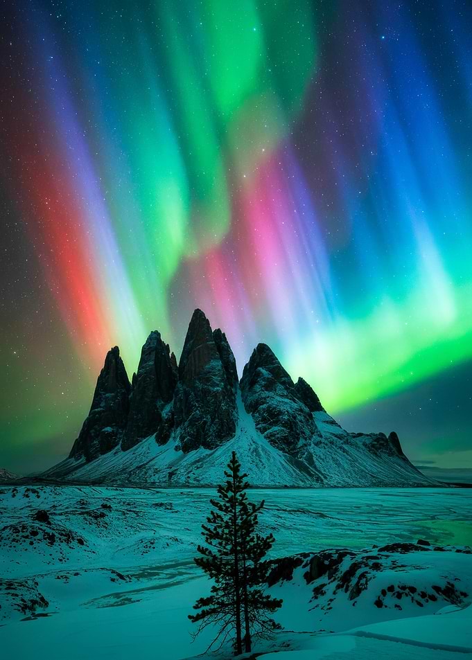 Aurora Borealis over Mountain Landscape