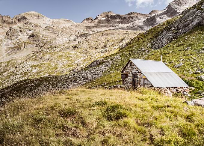 Stone Hut in Mountain Landscape