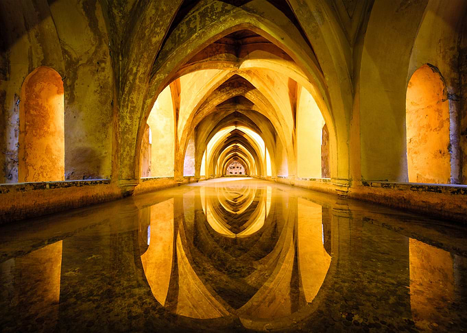 ancient arched hallway with water reflection