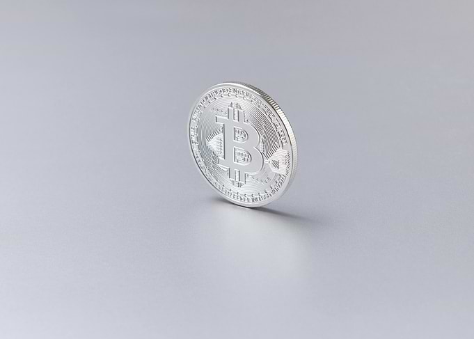 Silver Bitcoin Coin on Gray Background