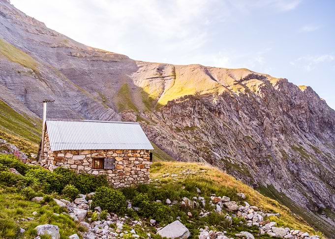 Stone Hut in Mountain Landscape