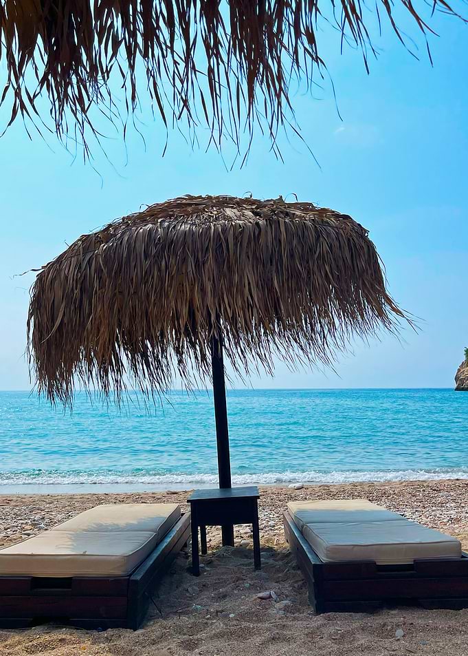 Beach Relaxation with Straw Umbrella