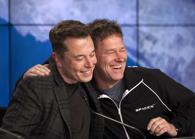 Elon Musk and Friend Smiling Together