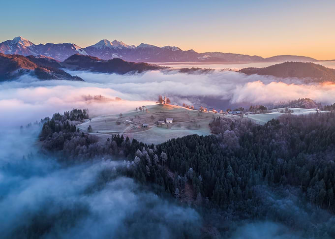Church on Hill in Foggy Landscape