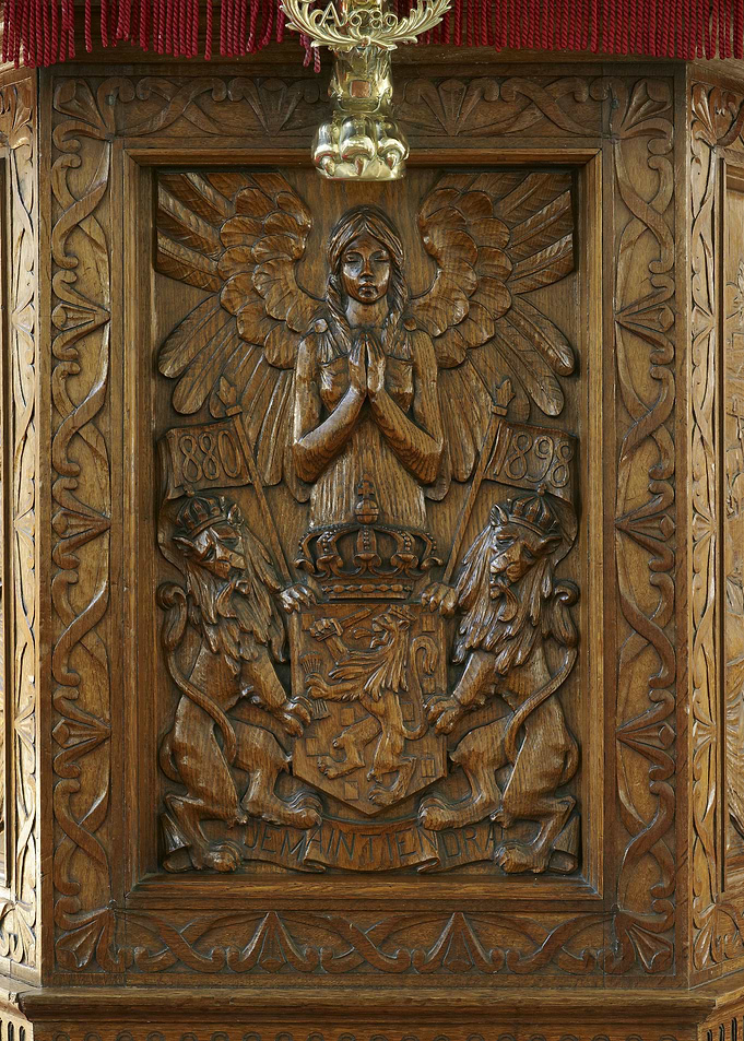 Ornate Wood Carving with Angel and Lions