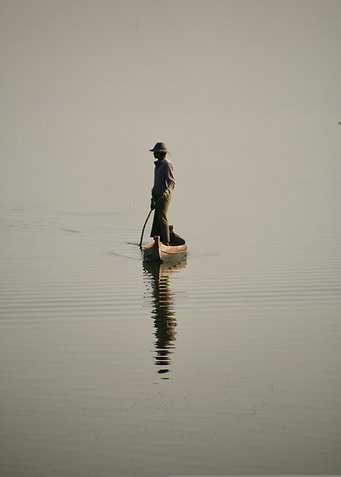 Man in boat on calm water