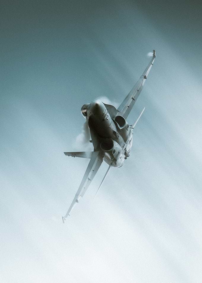 Fighter Jet Ascending in Blue Sky