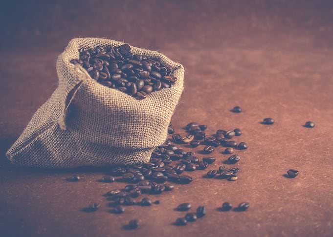 Coffee Beans Overflowing from Burlap Sack
