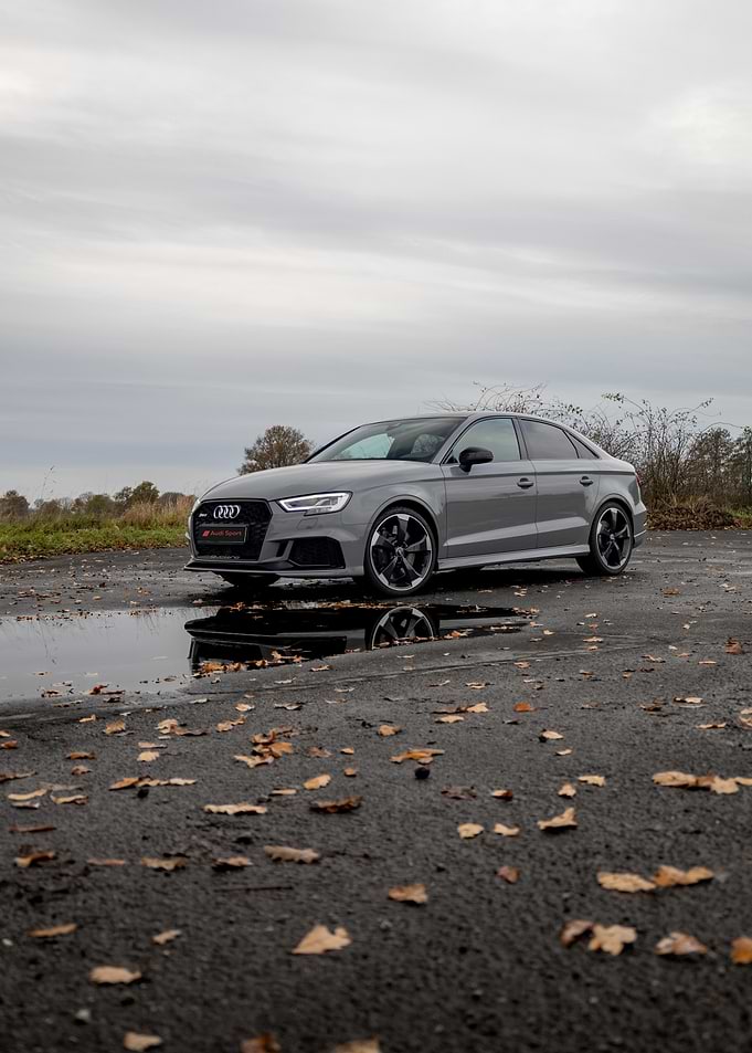 Gray Audi RS3 Sedan on Wet Asphalt