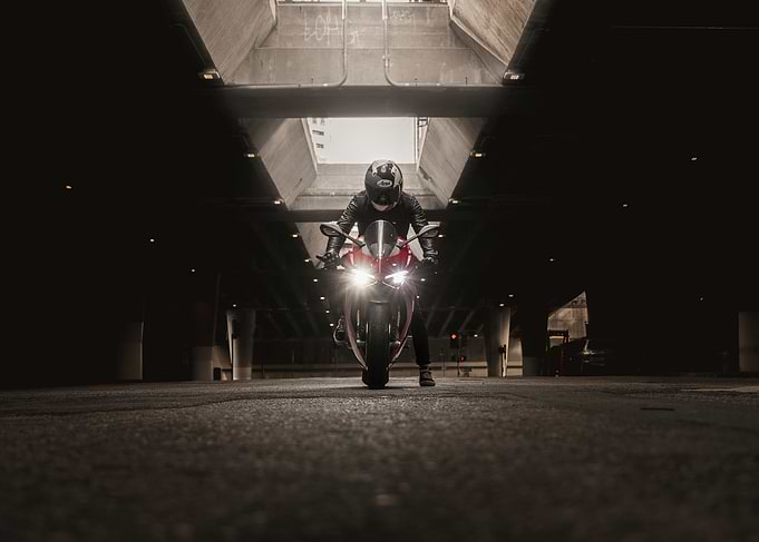 Motorcycle rider under concrete structure