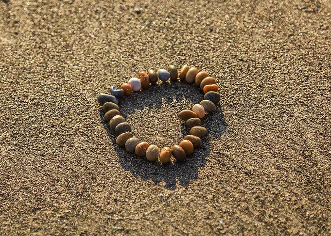 Pebble Bracelet on Sandy Beach