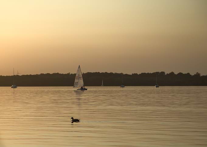 Sailboats on Water at Sunset