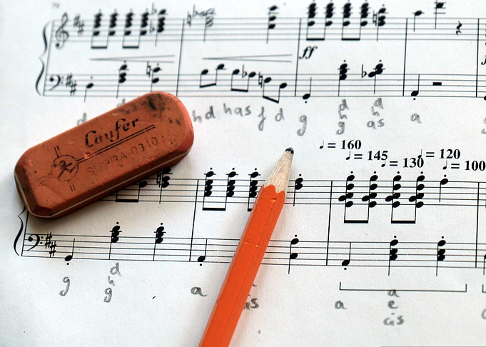 Music sheet with pencil and eraser
