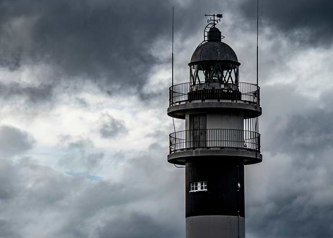Lighthouse against a stormy sky