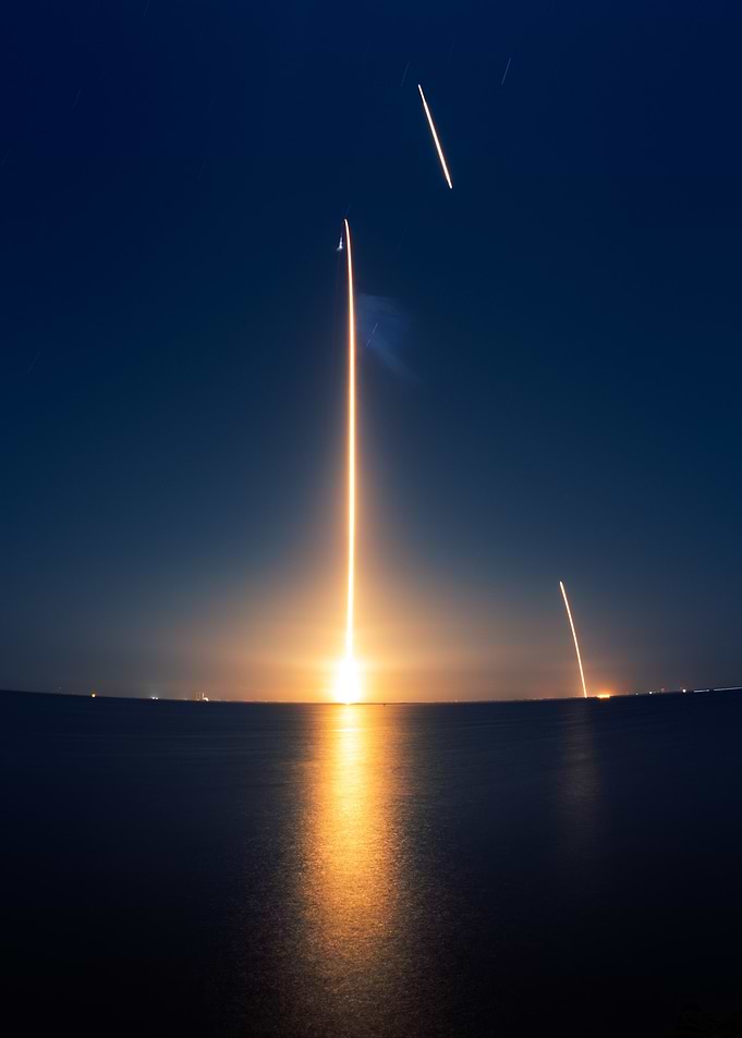 Rocket Launch at Night over Water