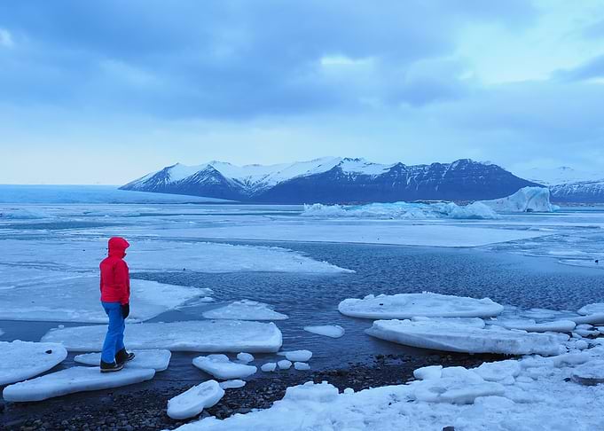 Person in Red Jacket on Ice