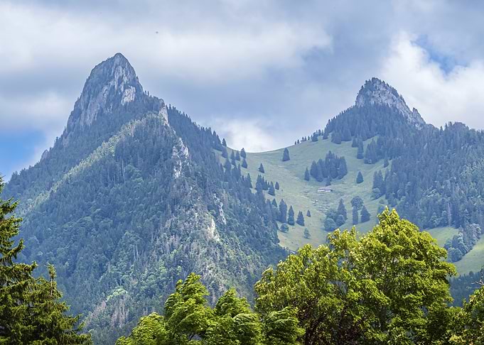 Majestic Mountain Peaks and Lush Greenery