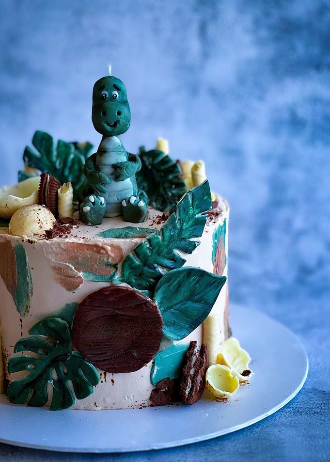 Dinosaur Cake with Tropical Leaves