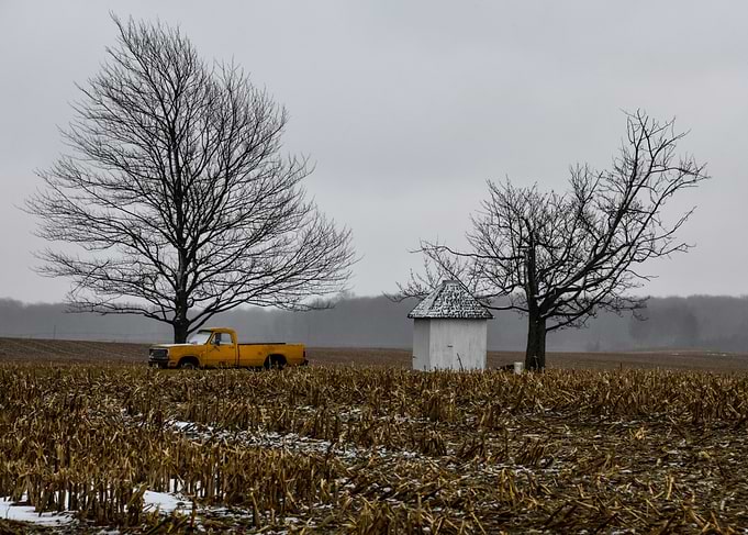 Yellow Truck in Winter Field