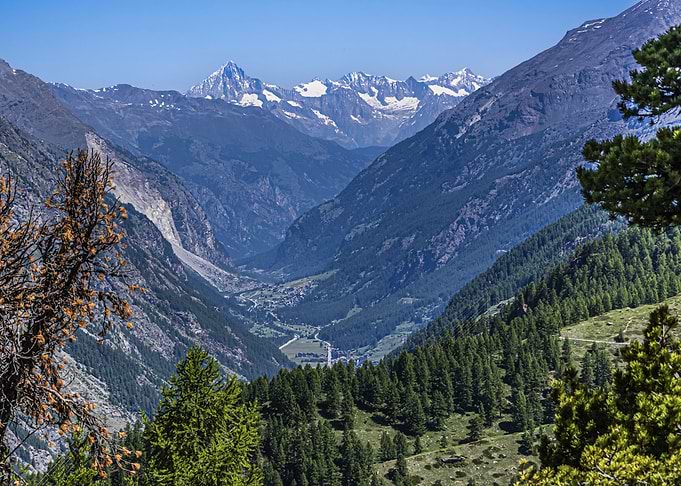 Alpine Valley Landscape with Snow-Capped Mountains