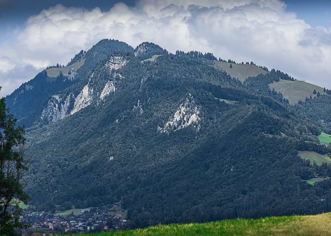 Lush Mountain Landscape with Cloudy Sky