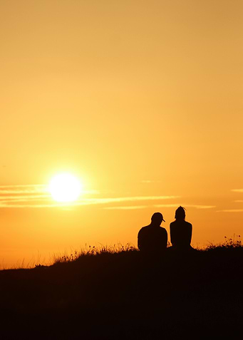 Silhouette of couple at sunset