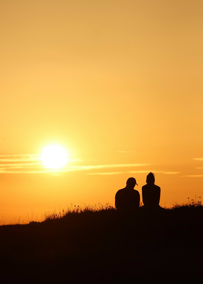 Silhouette of couple at sunset