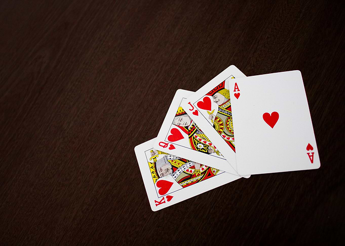 Royal Flush Hearts on Dark Wood