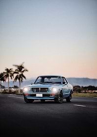 Classic Blue Car on Road