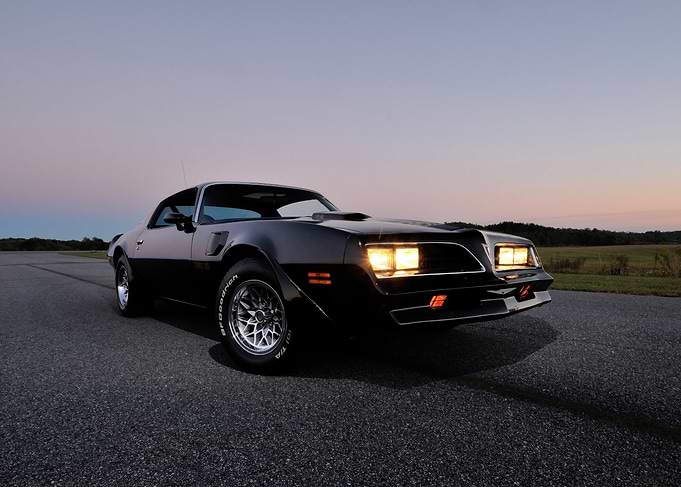 Black Pontiac Trans Am at Dusk