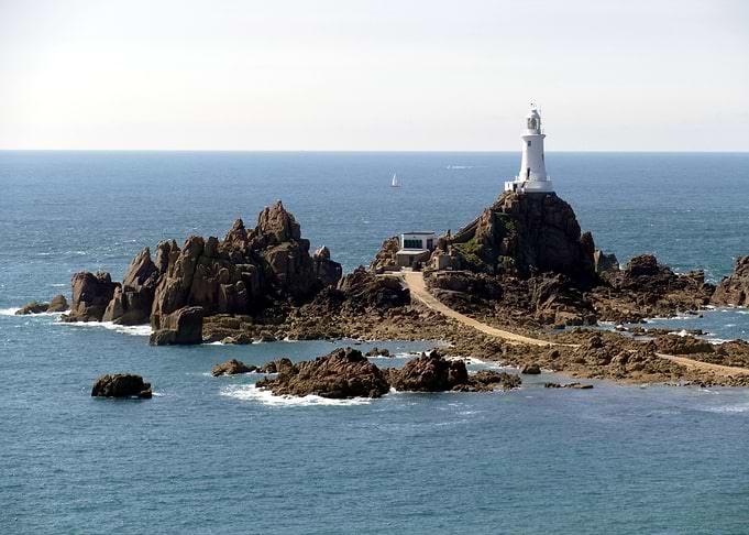 Lighthouse on Rocky Island in Ocean