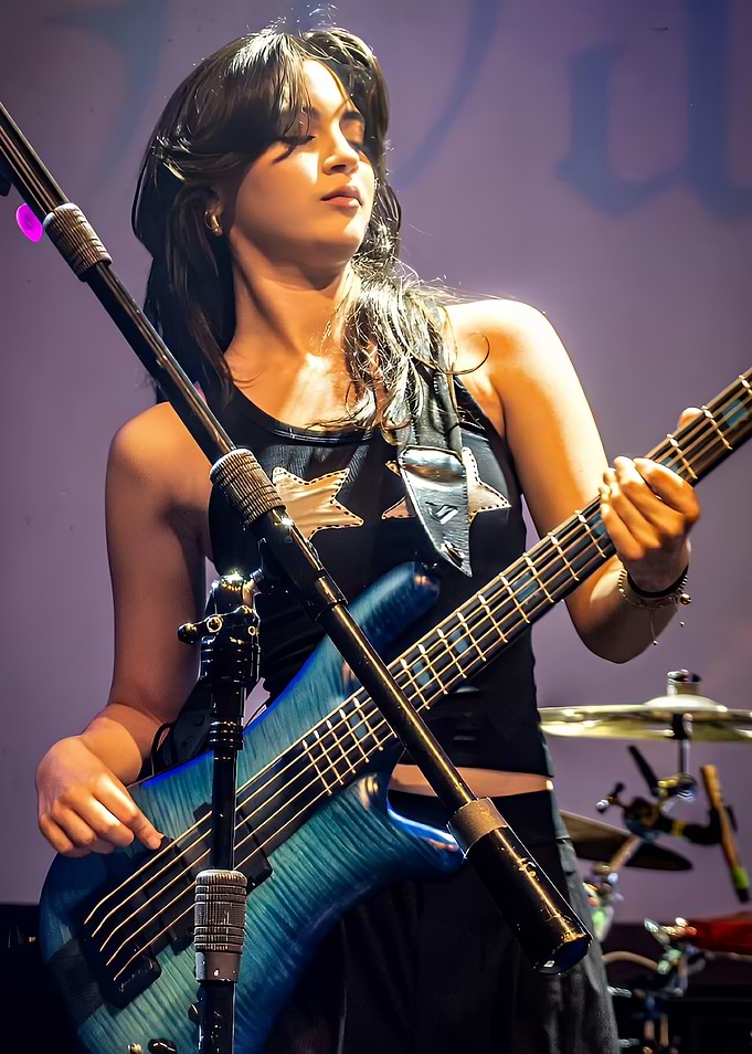 the warning Playing Blue Bass Guitar