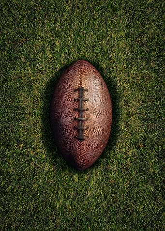 American Football on Green Grass
