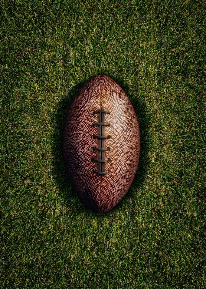 American Football on Green Grass