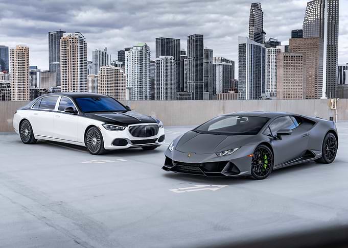 Luxury Cars with Cityscape Backdrop