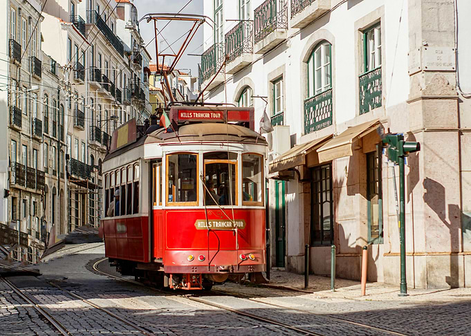 Lisbon Tram on Cobblestone Street