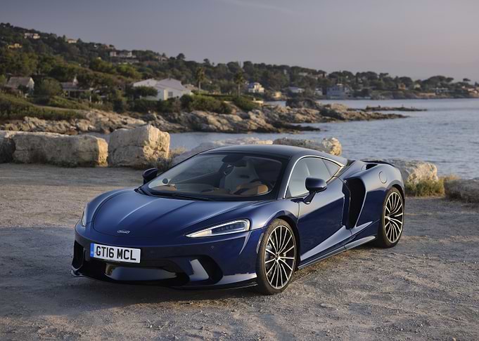 Blue McLaren GT on Coastal Road