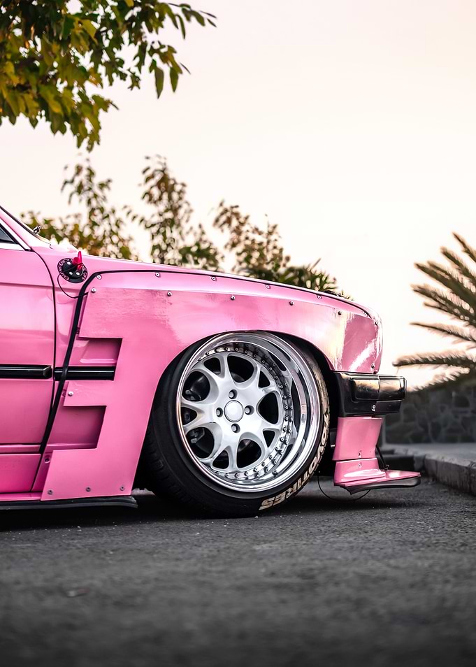 Pink Modified BMW E30 Car Wheel Close-Up