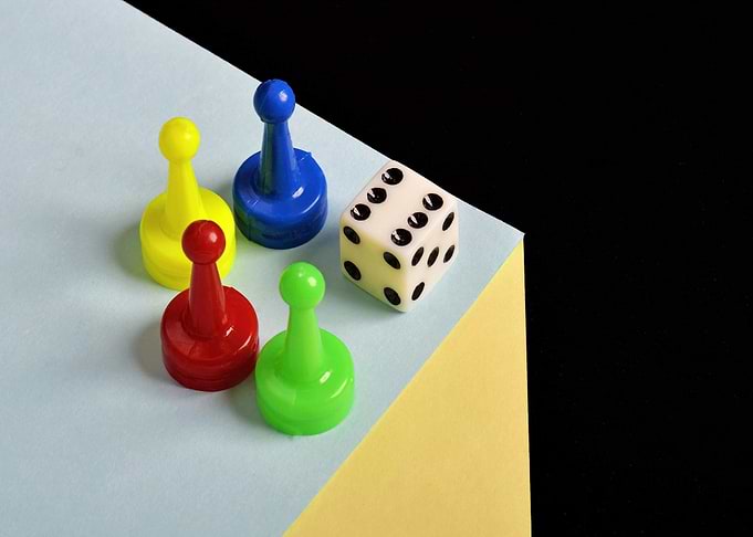Colorful Game Pieces and Dice Still Life