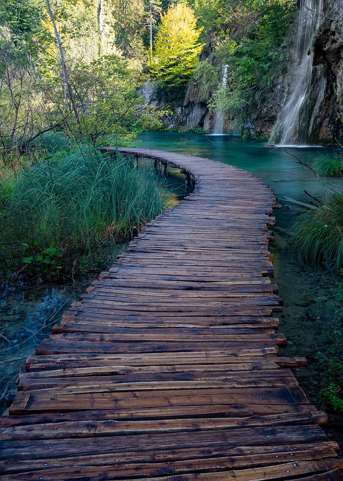 Wooden Path Over Waterfalls Landscape
