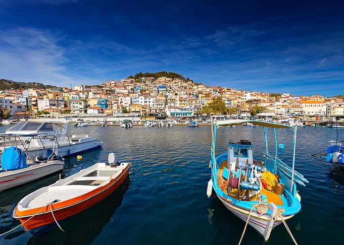 Picturesque harbor with colorful boats and town, Plomari, Lesvos